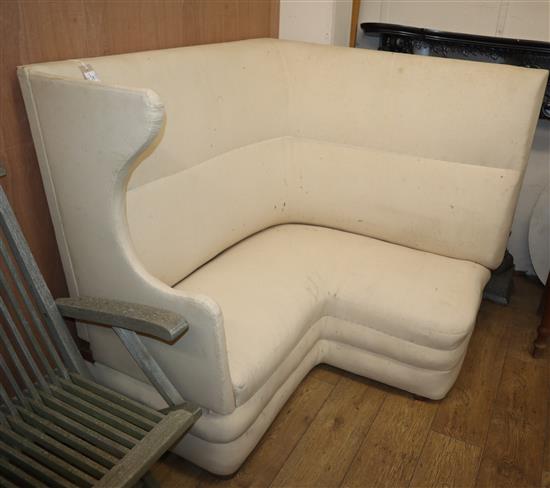 A 1920s corner wing sofa